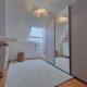 HOUTAIN : Ensemble immobilier: Maison 4ch avec jardin, surface commerciale, 3 appartements, terrain.
