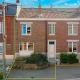 HOUTAIN : Ensemble immobilier: Maison 4ch avec jardin, surface commerciale, 3 appartements, terrain.