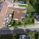 HOUTAIN : Ensemble immobilier: Maison 4ch avec jardin, surface commerciale, 3 appartements, terrain.
