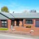 GLONS: Bungalow 2 chambres avec bureau, garage, jardin et terrain