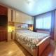 GLONS: Bungalow 2 chambres avec bureau, garage, jardin et terrain
