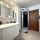 GLONS: Bungalow 2 chambres avec bureau, garage, jardin et terrain